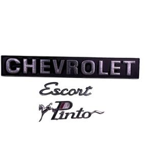 Vintage Chevrolet, Escort, Pinto 70s metal vehicle emblems bundle of 3